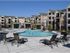 Regency pool area with 3 cabanas, 4 tanning chairs, and splash-pad