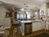 Open concept view of common area (living room, dining room, and kitchen) from dining room view point