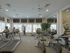 Fitness center with 2 treadmills, 2 stationary bikes, 1 elliptical, 4 flat screen televisions, free weights, and 4 weight machines