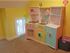 Inside of playroom showing play kitchen