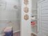 Master bathroom with storage space and large walk-in closet