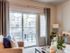 Pet-Friendly luxury apartments in Nampa, ID - The Station at Gateway - Patio with Table and Chairs Accessible from Living Room.