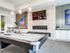 Game room with flat screen fireplace, seating area, and billiards table