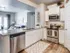 Kitchen with stainless steel appliances and walk-in pantry