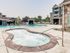 Three-Bedroom Apartments in Boise, ID - Kensington - Outdoor Infinity Hot Tub, Overlooking the Swimming Pool, Clubhouse, and Apartments.