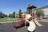Smaller playground with 3 slides and climbing structure