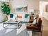 Model living room with couch, 2 chairs, coffee table, and side table