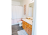 Master bathroom with sink vanity, toilet, and tub/shower combo