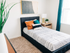 Second bedroom with twin bed and nightstand