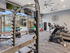Fitness center with free weights, exercise balls and mats, three flat screen televisions