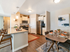 Kitchen and dining room with 4 person rectangular table and breakfast bar