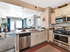 Kitchen with stainless steel appliances and walk-in pantry