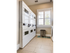 Laundry area with 4 washers, 6 dryers, and sink