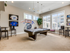 Game room with billiards table, flat screen television, and seating areas