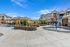 splash pad with water dumping buckets and outdoor patio furniture