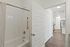 Second bathroom featuring shower tub insert.