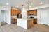 Alternative view of the kitchen highlighting the kitchen island and cabinetry