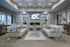 Kensington clubhouse waiting room with flat screen television and fireplace