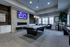 Game room with billiards table, shuffleboard, flat screen television, and fireplace