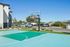 Vibrant outdoor basketball court with scenic mountain views, perfect for active living and community enjoyment.