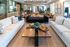 Elegant apartment space featuring a modern open-concept living area with stylish sofas, chic decor, and a spacious work-friendly environment.