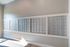 Contemporary apartment mailroom with sleek silver mailboxes, offering secure and organized mail storage.