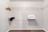 Spacious walk-in closet with organized shelving and cozy carpet flooring, perfect for stylish storage solutions.
