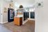 Bright mail room featuring secure mailboxes, community message board, and convenient snack vending machine.