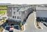 Modern townhouse complex with scenic mountain views, featuring guest parking and well-maintained landscaping.
