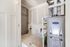 Modern utility room showcasing a sleek Carrier HVAC system with clean white walls and organized piping.