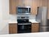 Modern stainless steel appliances paired with warm cabinetry create a kitchen you'll love coming home to.