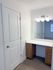 Dedicated vanity space adds convenience and functionality to your daily routine.