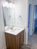 Modern bathroom finishes combine style and practicality with updated cabinetry and lighting.