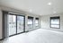 Bright and modern apartment with large windows, stylish flooring, and a spacious open layout.