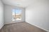 Bright and airy room with new carpet and large window providing a stunning view and natural light.
