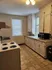Charming kitchen featuring warm lighting, abundant cabinetry, and modern appliances for a functional culinary space.