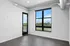 Bright and airy room with modern finishes and expansive window overlooking lush greenery.