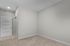 Bright, spacious room with clean lines, neutral tones, and modern door, ideal for a customizable living area.