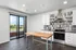 Modern kitchen with sleek stainless steel appliances, elegant white cabinetry, and a spacious wooden island, complemented by a scenic balcony view.