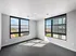 Bright and modern room with large windows offering scenic views, perfect for a serene living space.