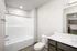 Modern bathroom design featuring a sleek bathtub, contemporary fixtures, and elegant cabinetry.