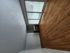 Bright and airy living room with expansive windows and elegant hardwood flooring.