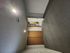 Spacious bedroom featuring cozy carpeting and ample closet space with natural light from ceiling fixtures.