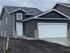 Charming modern house with a spacious garage and inviting exterior design.