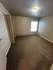 Bright and spacious bedroom with plush carpet and ample natural light.
