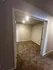 Inviting room with plush carpet and soft recessed lighting, perfect for creating a cozy space.