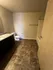 Chic bathroom with elegant tiled flooring, sleek vanity, and modern fixtures.
