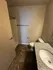 Modern bathroom featuring elegant granite countertop, spacious shower area, and stylish tile flooring.