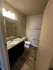 Modern bathroom with elegant granite countertop, sleek fixtures, and ambient lighting.