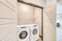 Modern apartment laundry area with sleek washer and dryer, offering convenience and efficiency in a bright, spacious setting.